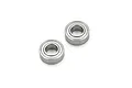 Two small metal shielded ball bearings shown from an angled top-down perspective against a white background.