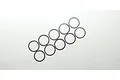 Ten thin, circular stainless steel shims arranged in two rows on a plain white background.