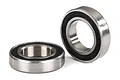 Two Traxxas 12x21x5mm ball bearings with black rubber seals, one lying flat and one standing upright on a white background.