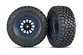Two Traxxas RC wheels with BFGoodrich Baja KR3 tires mounted on black Method Racing rims with blue beadlock-style rings, isolated on a white background.