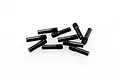 A small pile of ten black metal grub screws with a smooth shaft and threaded end on a white background.