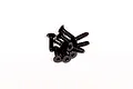 A small pile of black metal countersunk head screws with coarse threads, suitable for RC hobby applications.