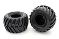 Two Kyosho Sand Monster RC truck tyres premounted on black rims against a white background.
