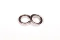 Two metal shielded ball bearings placed side-by-side on a plain white background.