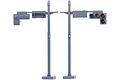 Two grey plastic 1/24 scale traffic signal poles from Fujimi, one showing the back and one showing the front with green, amber, and red lights.