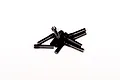 A small pile of black metal grub screws with threaded ends on a plain white background.