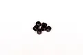 A small pile of six black metal grub screws with hex sockets on a plain white background.