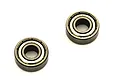 Two Kyosho metal shielded ball bearings shown against a plain white background.