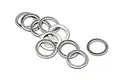 A small pile of ten thin, circular steel washers scattered on a white background.