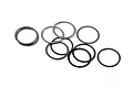 A collection of ten thin, circular metal washers scattered on a plain white background.