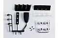 A set of unassembled black and chrome plastic RC car accent light parts including lenses, housing, and small screws on a white background.