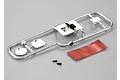 Killerbody 1/10 scale touring car fuel door accessory kit on a chrome plastic parts tree with double-sided tape and two small screws.