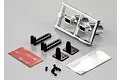 Killerbody 1/10 scale RC exhaust pipe set including chrome exhaust tips on a sprue, mounting brackets, screws, adhesive tape, and heat shield material.