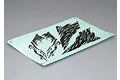 A sheet of black graphic decals on a light blue backing paper, featuring abstract jagged patterns for RC crawler bodies.