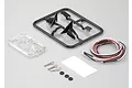 Killerbody 1/10 scale touring car wing mirror set with LED lights, plastic parts trees, body clips, and small rubber rings on a grey background.