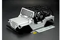 Killerbody 1/10 scale silver painted crawler body shell with black roll cage and included decal sheet on a dark background.
