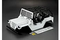 A white 1/10 scale RC crawler body shell by Killerbody, featuring a black roll cage, interior seats, and included decal sheets on a dark background.