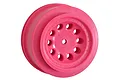A single bright pink RPM Revolver 2.2-inch RC short course wheel rim shown from a three-quarter angle against a white background.