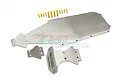 GPM Racing stainless steel chassis skid plate set for RC cars, including main plate, smaller plates, and gold-colored mounting screws on a white background.