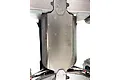 Bottom view of an ARRMA Outcast 8S RC truck chassis featuring a black T-Bone Racing full chassis skid plate installed.