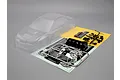 Unpainted clear polycarbonate RC car body shell for a 2007 Subaru Impreza WRC, including plastic accessory parts, decals, and chrome-plated light buckets.