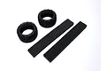 Two black Kyosho Neo Bloc RC tyres and two rectangular black foam inserts arranged on a white background.