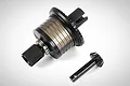 Rovan gun metal aluminium complete differential assembly with a separate pinion gear on a white background.