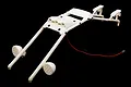 A white Rovan Baja roll bar set with integrated LED light mounts and two round LED light pods, isolated against a black background.