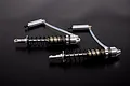 Two silver Rovan heavy-duty RC rear shock absorbers with external reservoirs connected by clear tubing, set against a dark background.