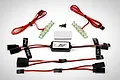 Rovan RC light controller kit featuring a central control module, two LED light strips, wiring harnesses with labeled connectors, and mounting hardware.
