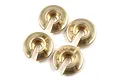 Four brass spring retainers for RC car suspension arranged on a white background.