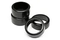 A set of four smooth black RC drift tyres for HPI Micro RS4, arranged in a stack and two loose pieces on a white background.