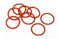 A cluster of eight orange rubber O-rings arranged on a plain white background.