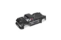 ARRMA 1/5 scale Outcast black painted RC truck body shell with pre-applied decals, shown from a high-angle studio view.