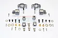 A set of silver aluminium RC car suspension parts including C-hubs, steering knuckles, wheel hex adapters, screws, and spacers on a white background.