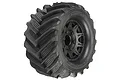 Pro-Line 2.8 inch Demolisher monster truck tire pre-mounted on a black Raid wheel, featuring aggressive tractor-style tread pattern.