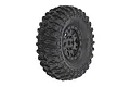 A single Pro-Line 1.0 inch Hyrax crawler tyre mounted on a black Impulse beadlock rim, shown against a plain white background.