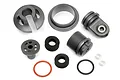 A set of HPI Baja shock absorber replacement parts including plastic caps, threaded collars, foam seals, O-rings, and metal washers on a white background.