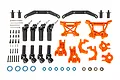 Traxxas Extreme Heavy Duty upgrade kit in orange, featuring suspension arms, drive shafts, and various hardware components for RC cars.