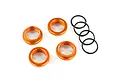 Four orange anodized aluminium shock spring retainers and four black rubber O-rings on a white background.