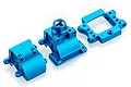 Three blue anodized aluminium gearbox case components for an RC car, arranged on a white background.