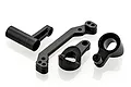 A set of four black aluminium RC car steering components including a servo saver arm and bell crank parts on a white background.