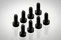 A group of eight black metal cap head screws arranged on a white surface.