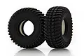 Two black rubber RC off-road tires with aggressive tread patterns and white foam inserts, standing upright on a white background.