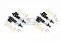 A set of four black aluminium piggyback shock absorbers for an RC car, including gold springs and mounting hardware, displayed on a white background.