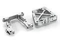 Two silver aluminium RC car rear bulkhead components shown from a top-down angle on a white background.