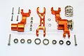 GPM Racing orange aluminium steering assembly set with servo saver components laid out on a white background.
