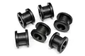Six black rubber bushings arranged in a group on a white background.