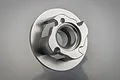A silver-coloured aluminium easy-start turbine component for an RC engine, shown from a top-down angle against a neutral grey background.
