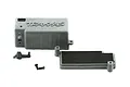 Traxxas battery box components including the main grey plastic housing, a lid with foam padding, a small latch, and a mounting screw.